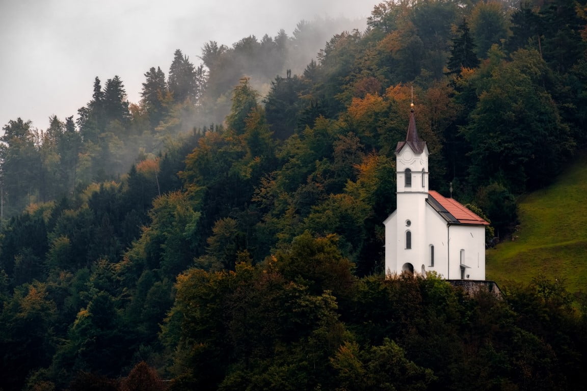 scenic view of small church on a hill among trees 2021 08 27 09 44 04 utc Medium