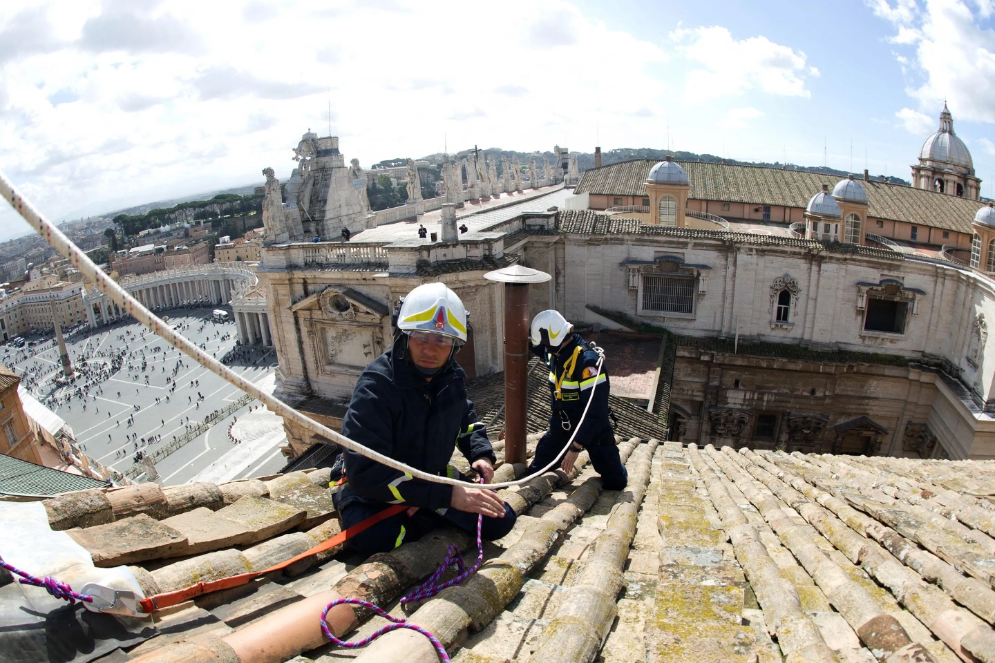 Vaticans firefighters setting up the chimney on the roof of the Sistine chapel ahead of the cardinals conclave AFP 000 DV1435141 Custom